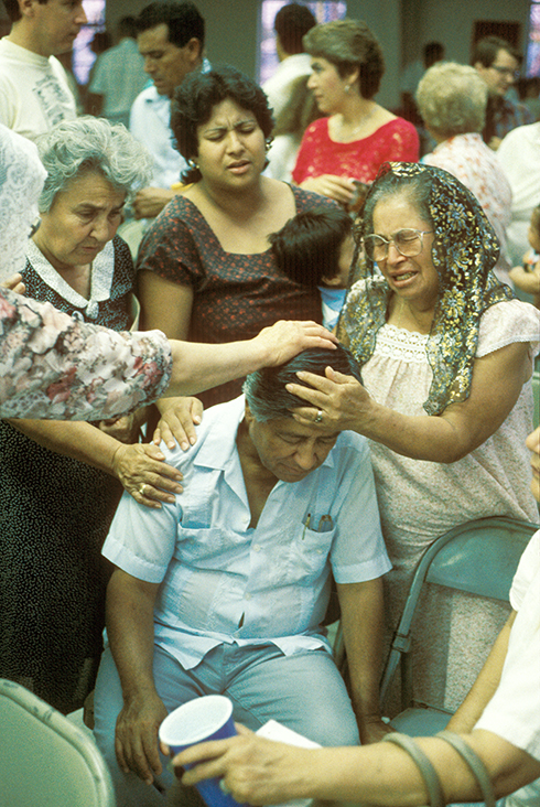 “Farmworker women praying for Cesar during his Fast for Life” / 40 Acres, Delano, CA / Nikon F2; Kodak Ektachrome 400 ASA