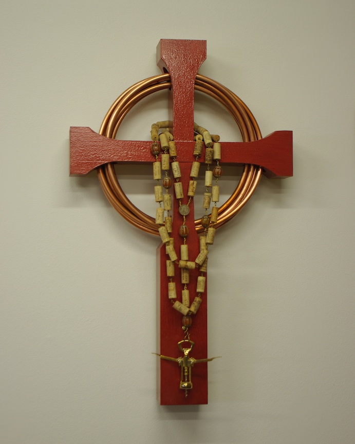 Reclaimed Douglas fir wood, scarlet epoxy paint, copper tube, wine corks, synthetic amber beads, brass wire and brass plated corkscrew. 26" H x 42" W x 8" D  (2009)